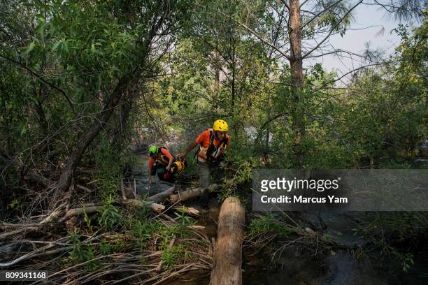 Ransom Yarger and Paulina Stanfield, conducts a search mission for the missing person reported the day before, in a raging part of the Kern River, in...