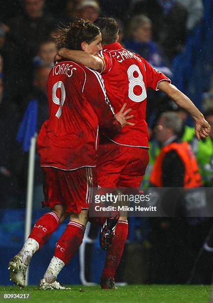 Fernando Torres of Liverpool celebrates with Steven Gerrard as he scores their first goal during the UEFA Champions League Semi Final 2nd leg match...