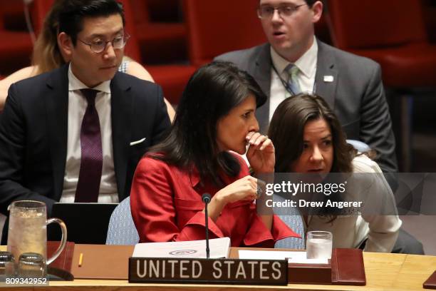 Nikki Haley, United States ambassador to the United Nations, confers with an aide during an emergency meeting of the U.N. Security Council at United...