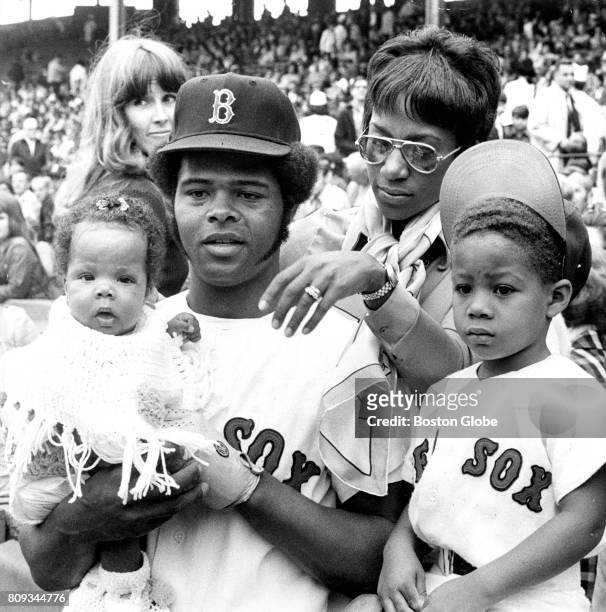 Boston Red Sox player Reggie Smith and his wife Ernestine are pictured with their children Nicole, 4 months old, and Reggie Jr. During a game against...