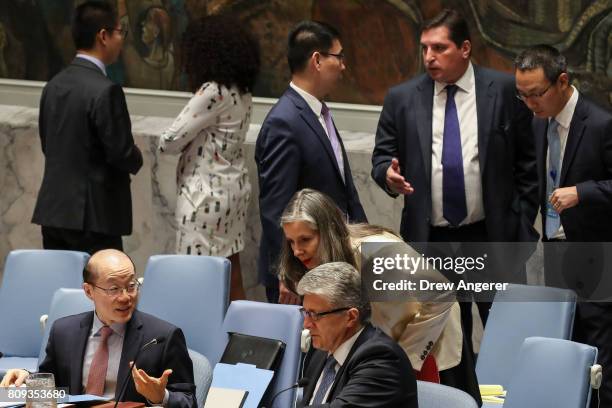 Liu Jieyi, Chinese ambassador to the United Nations, speaks to Miroslav Jenca, U.N. Assistant Secretary-General for Political Affairs, as Russian...