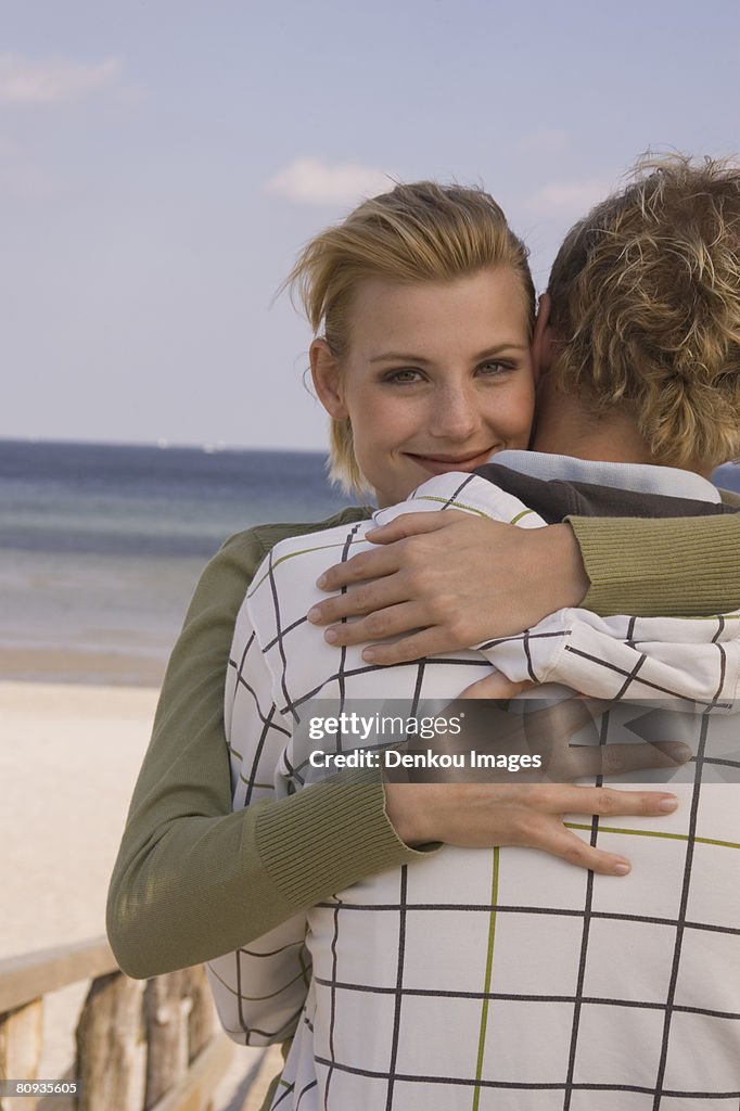 Young couple hugging at the beach