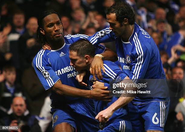 Frank Lampard of Chelsea celebrates with Didier Drogba and Ricardo Carvalho as he scores their second goal from the penalty spot during the UEFA...