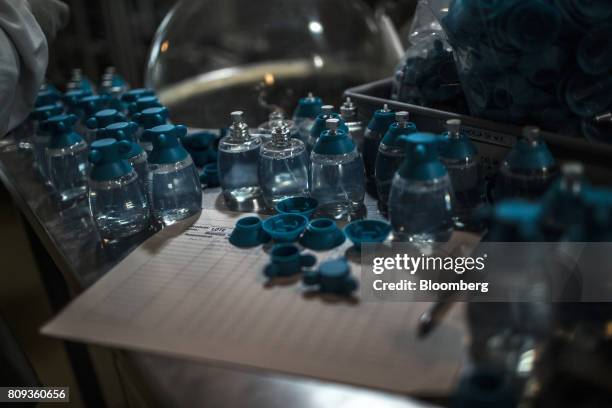 Bottles sit on a table at the Natura Cosmeticos SA production facility in the town of Cajamar, Sao Paulo State, Brazil, on Wednesday, June 28, 2017....