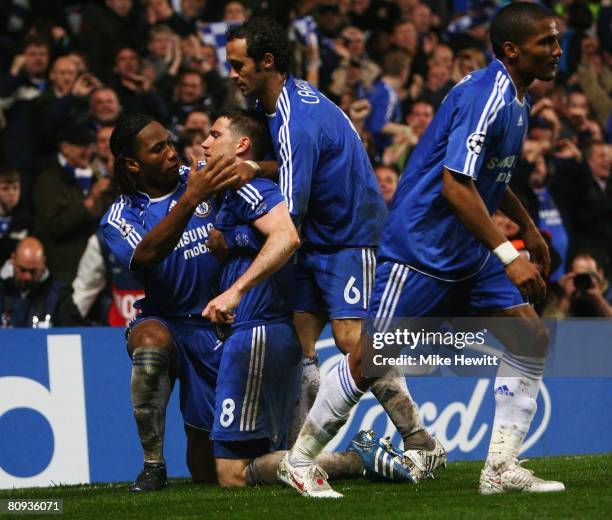 Frank Lampard of Chelsea celebrates with Didier Drogba and Ricardo Carvalho as he scores their second goal from the penalty spot during the UEFA...