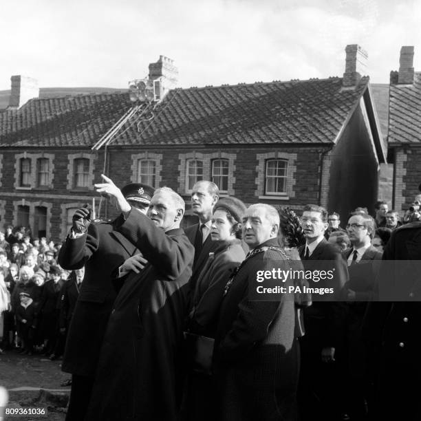 The Queen and Duke of Edinburgh view the destruction to the village of Aberfan after a catastrophic collapse of a colliery spoil-tip which killed 116...