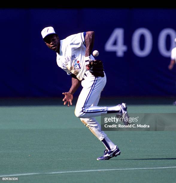 Tony Fernandez of the Toronto Blue Jays fields a ball during a game against the Boston Red Sox on August 25, 1990 in Toronto, Ontario, Canada.