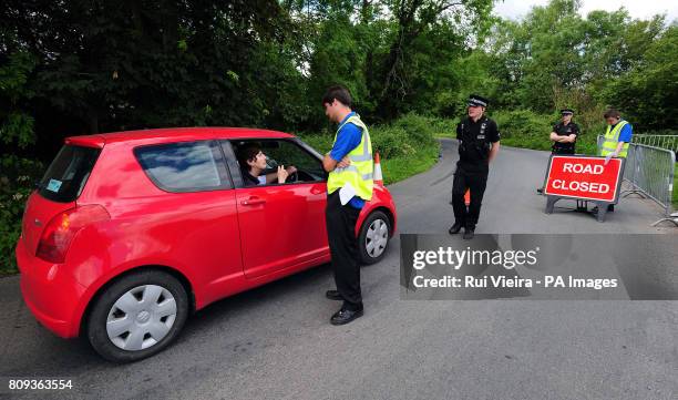 Car approaches a road block leading to Southrop village where Kate Moss is due to tie the knot with her rockstar fiance Jamie Hince.