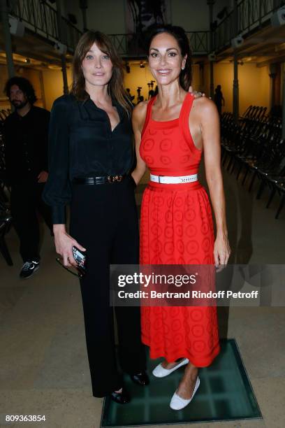 Carla Bruni-Sarkozy and Tasha de Vasconcelos attend the Azzedine Alaia Fashion Show as part of Haute Couture Paris Fashion Week. Held at Azzedine...