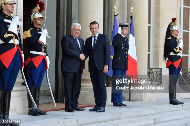 French President Emmanuel Macron welcomes Palestinian President Mahmoud Abbas for a meeting at Elysee Palace on July 5, 2017 in Paris, France....