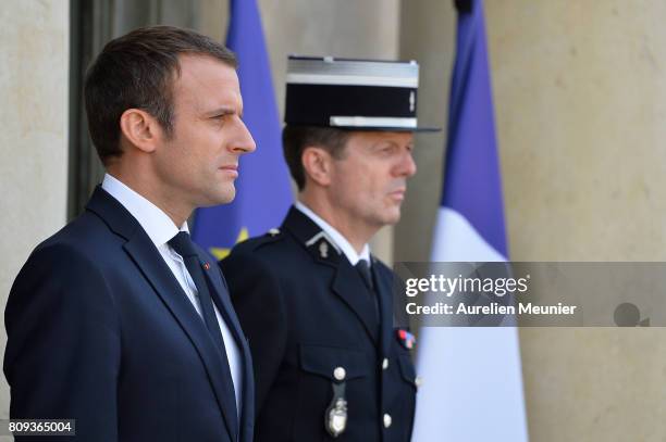 French President Emmanuel Macron waits to welcome Palestinian President Mahmoud Abbas for a meeting at Elysee Palace on July 5, 2017 in Paris,...