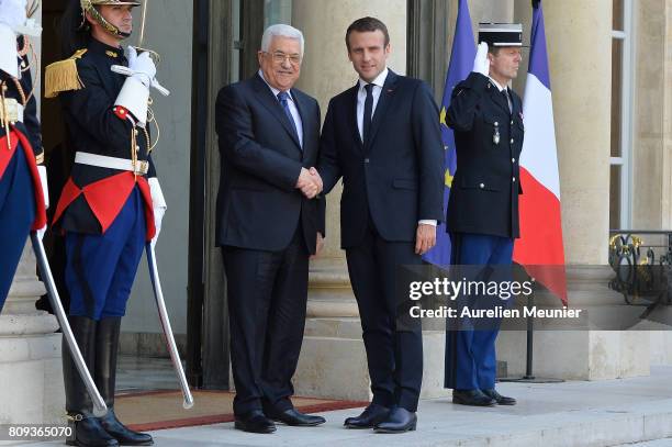 French President Emmanuel Macron welcomes Palestinian President Mahmoud Abbas for a meeting at Elysee Palace on July 5, 2017 in Paris, France....