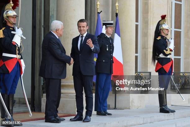 French President Emmanuel Macron welcomes Palestinian President Mahmoud Abbas for a meeting at Elysee Palace on July 5, 2017 in Paris, France....