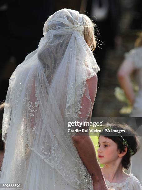 Kate Moss leaves after her wedding to Jamie Hince at St Peter's Church in Southrop.