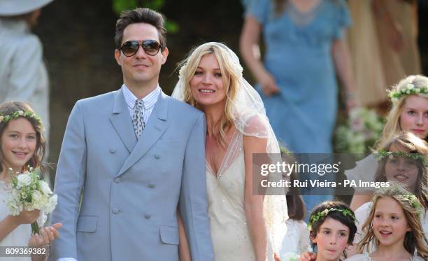 Kate Moss with her new husband Jamie Hince after their wedding at St Peter's Church in Southrop.