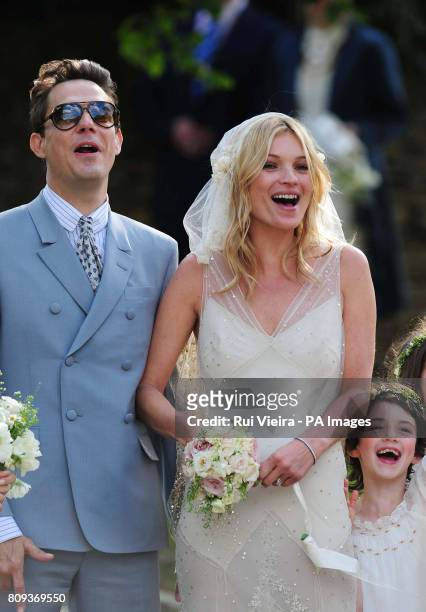 Kate Moss with her new husband Jamie Hince after their wedding at St Peter's Church in Southrop.