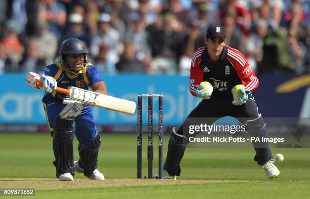 Sri Lanka batsman Kumar Sangakkara scores off England bowler Graeme Swann, watched by wicketkeeper Craig Kieswetter during the fourth Natwest ODI...