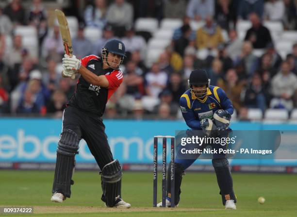 England's captain Alastair Cook drives the ball watched by Sri Lanka wicketkeeper Kumar Sangakkara during the fourth Natwest ODI match at Trent...