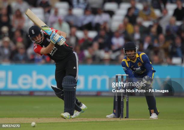 England's Craig Kieswetter drives the ball watched by Sri Lanka wicketkeeper Kumar Sangakkara during the fourth Natwest ODI match at Trent Bridge,...
