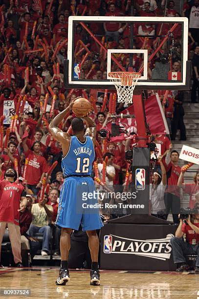 Dwight Howard of the Orlando Magic shoots a free throw in Game Four of the Eastern Conference Quarterfinals against the Toronto Raptors during the...
