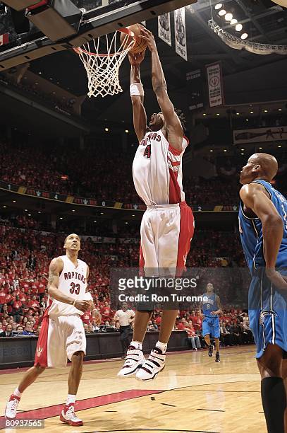 Chris Bosh of the Toronto Raptors goes for a dunk against the Orlando Magic in Game Three of the Eastern Conference Quarterfinals during the 2008 NBA...