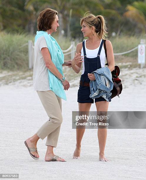 Actor Owen Wilson's mother Laura Wilson and actress Jennifer Aniston are seen filming a scene from the movie "Marley & Me" at the beach behind the...