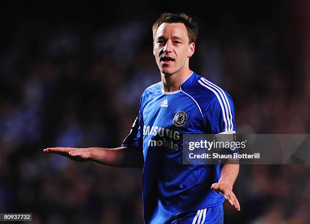 John Terry of Chelsea gestures towards the Liverpool fans after victory following the UEFA Champions League Semi Final 2nd leg match between Chelsea...