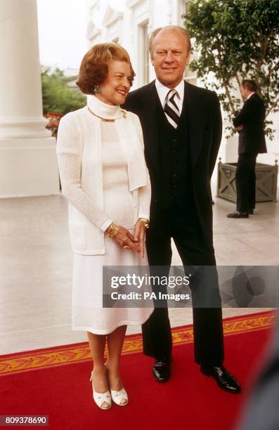 American President Gerald Ford and his wife Betty, waiting for the arrival of Queen Margrethe and Prince Henrik of Denmark on the front porch of the...