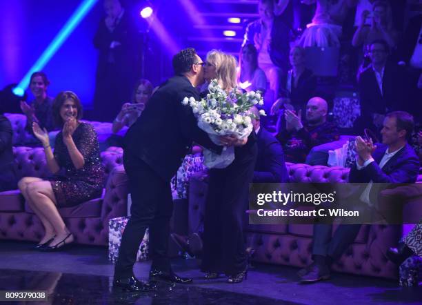 Designer Guido Maria Kretschmer acknowledges the applause of the audience the runway during the Guido Maria Kretschmer Fashion Show Autumn/Winter...