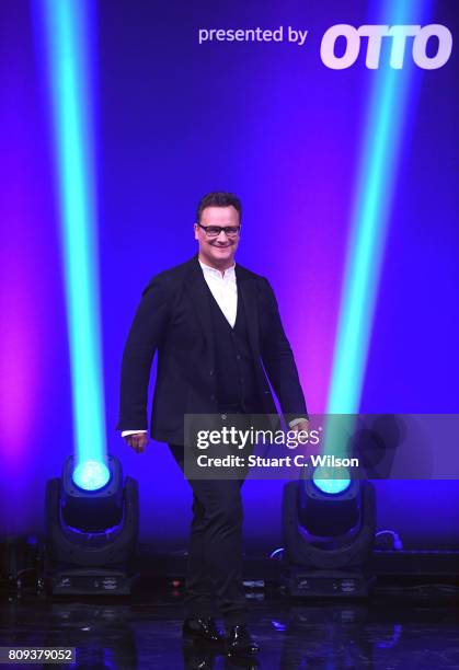 Designer Guido Maria Kretschmer acknowledges the applause of the audience the runway during the Guido Maria Kretschmer Fashion Show Autumn/Winter...