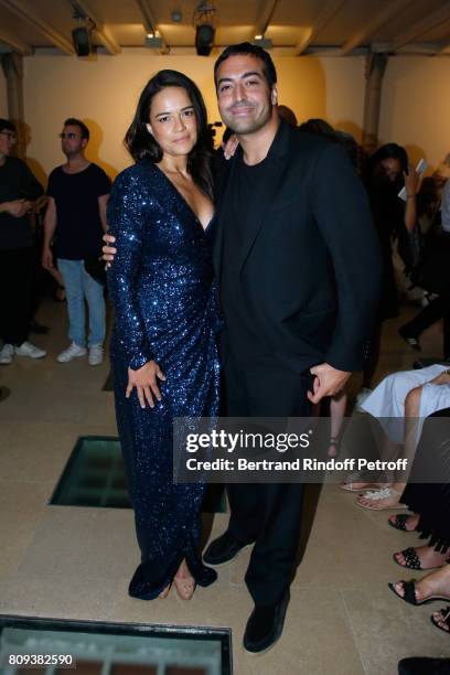 Actress Michelle Rodriguez and producer Mohammed Al Turki attend the Azzedine Alaia Fashion Show as part of Haute Couture Paris Fashion Week. Held at...