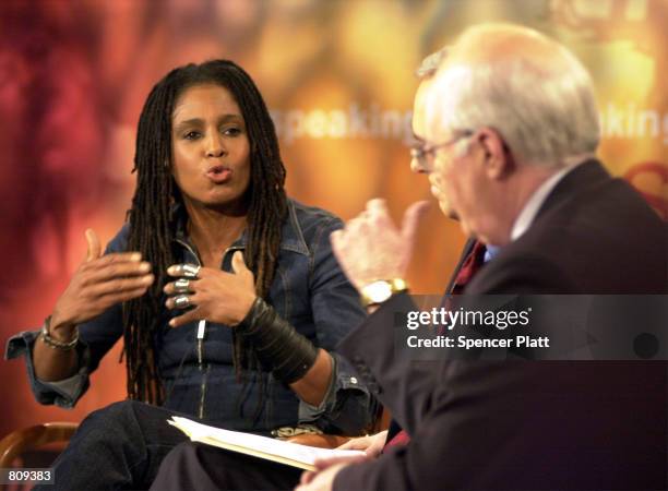 Photographer Renee Cox disputes a point February 20, 2001 with William A. Donahue, president of the Catholic League for Religious and Civil Rights...