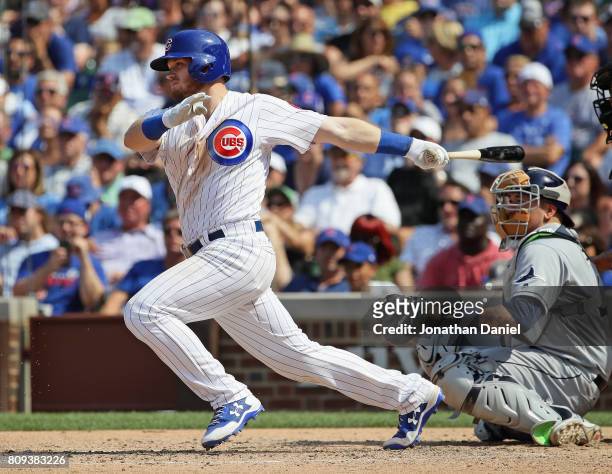 Ian Happ of the Chicago Cubs hits a two run single in the 7th inning against the Tampa Bay Rays at Wrigley Field on July 5, 2017 in Chicago, Illinois.