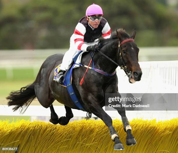 Jockey Paul Hamblin riding Scarface Claw clears the last hurdle in Race One the Sovereign Resort Hurdle during day three of the Warrnambool May...