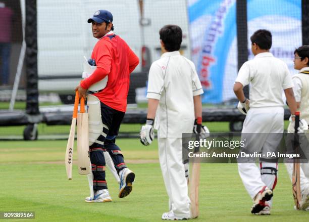 Sachin Tendulkar's son Arjun Tendulkar, 9 shares a laugh with India's captain MS Dhoni a practice session at Lord's Cricket Ground, London