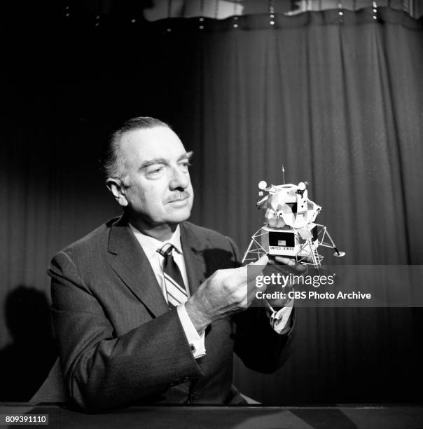 News anchor Walter Cronkite with a scale model of the Apollo 11 lunar module. Image dated February 20, 1969. New York, NY.