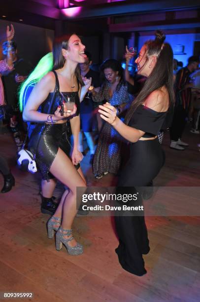 Dua Lipa and Charli XCX attend the Warner Music Group and British GQ Summer Party in partnership with Quintessentially at Nobu Hotel Shoreditch on...