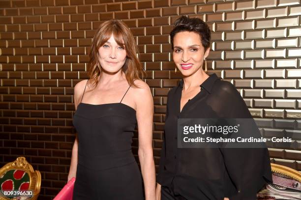 Carla Bruni-Sarkozy and Farida Khelfa Seydoux attend the Jean Paul Gaultier Haute Couture Fall/Winter 2017-2018 show as part of Haute Couture Paris...