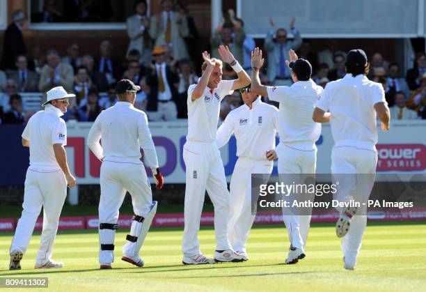 England's Stuart Broad is congratulated after bowling out India's Abhinav Mukund for 12 during day four of the First npower Test at Lord's Cricket...