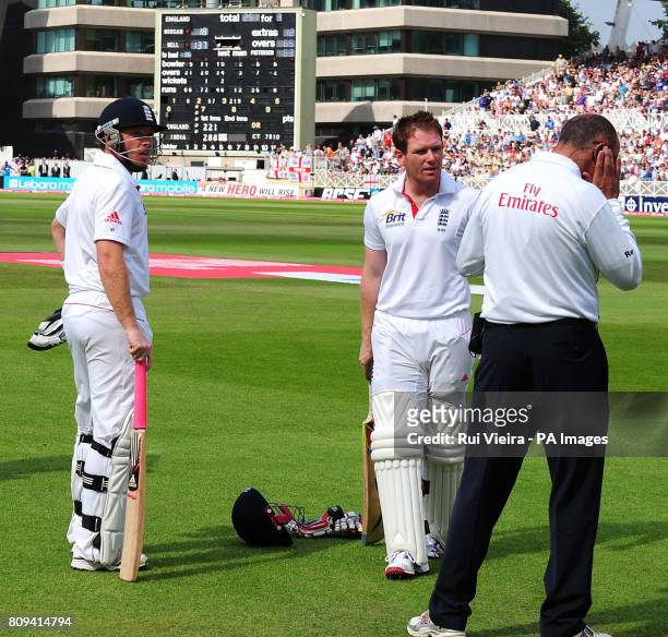England's Ian Bell and Eoin Morgan wait for the decision on a controversial run out during the second npower test match at Trent Bridge, Nottingham.