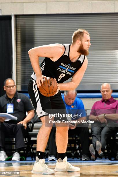 Przemek Karnowski of the Orlando Magic handles the ball during the game against the New York Knicks during the 2017 Orlando Summer League on July 5,...