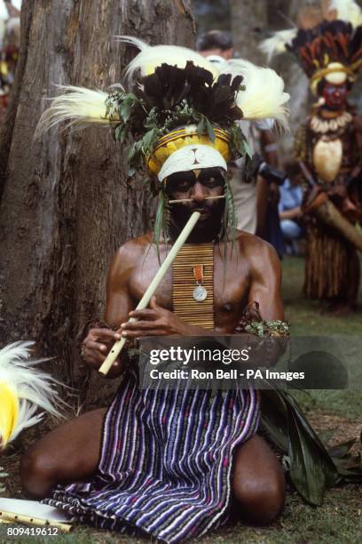 Tribal musician plays for the Royal party during the Singsing held at the Old Golf course, Mt Hagen, Papua New Guinea