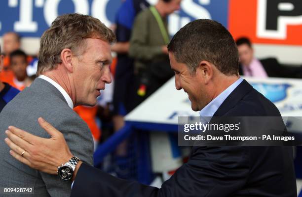 Everton's manager David Moyes shakes hands with Villarreal coach Juan Carlos Garrido