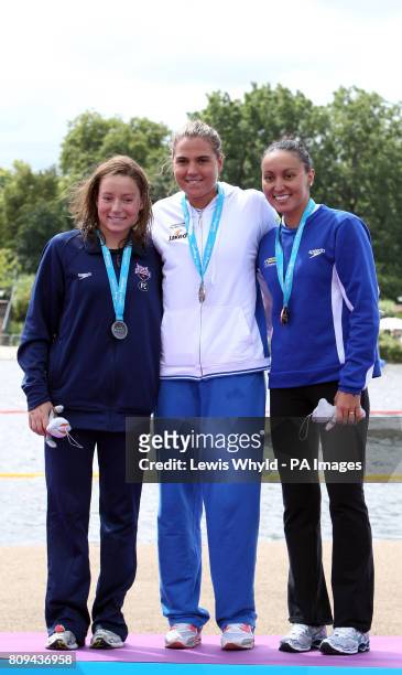 Italy's Martina Grimaldi poses with her gold medal with silver medalist USA's Eva Fabian and bronze medalist Brazil's Poliana Okimoto during the...