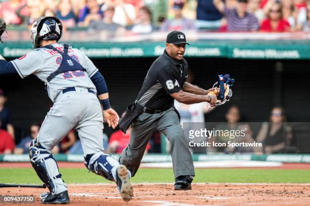 Home plate umpire Alan Porter calls Cleveland Indians third baseman Jose Ramirez out at home plate during the second inning of the Major League...