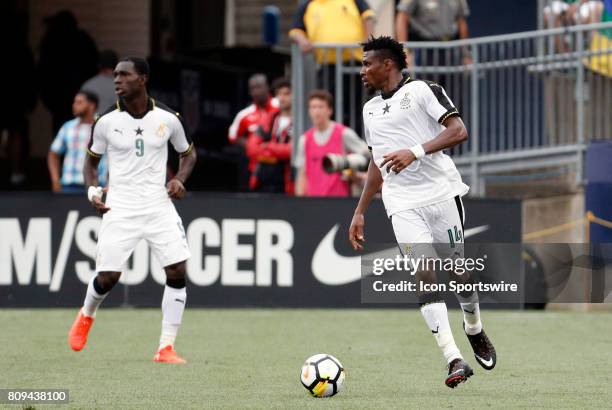 Ghana defender Jerry Akaminko looks inside during an international friendly between the United States and Ghana on July 1 at Pratt & Whitney Stadium...