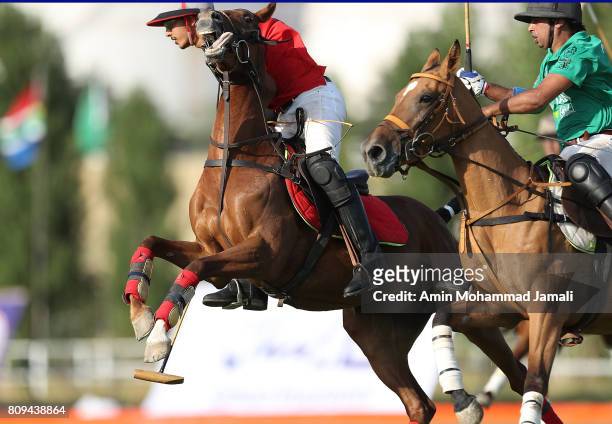Reza Behboudi of Iran and Agha Mousa Alikhan of Pakistan in action during World Polo Championship 2017 Qualifiers on July 5, 2017 in Tehran, Iran.