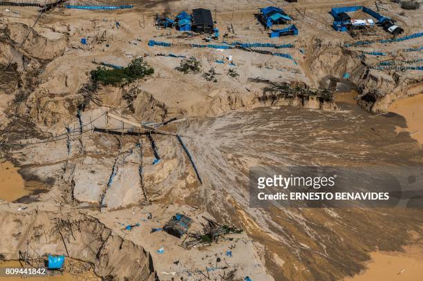 Aerial picture of an illegal gold mining camp in La Pampa, in Madre de Dios, southern Peruvian jungle on July 05, 2017. - In an unprecedented...