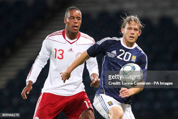 Scotland's Craig MacKail-Smith and Denmark's Mathias Jorgensen in action
