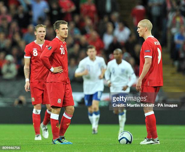 Wales' Steve Morison and Aaron Ramsey wait to kick-off after England's Ashley Young scores his team's opening goal during the UEFA Euro 2012...